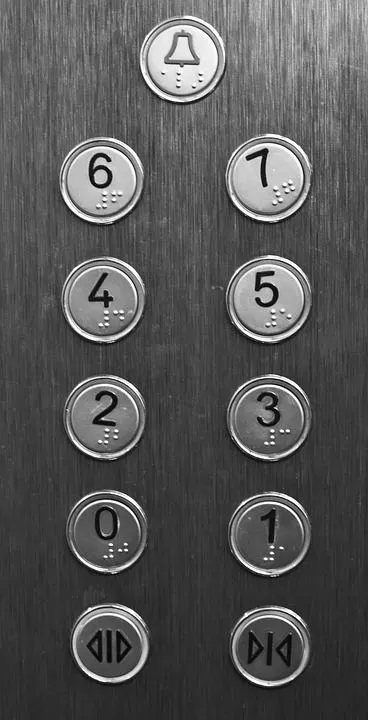 Hairline stainless steel elevator car operating panel with round tactile floor buttons, grade-1 braille markings, alarm bell and door open close buttons to EN 81-70