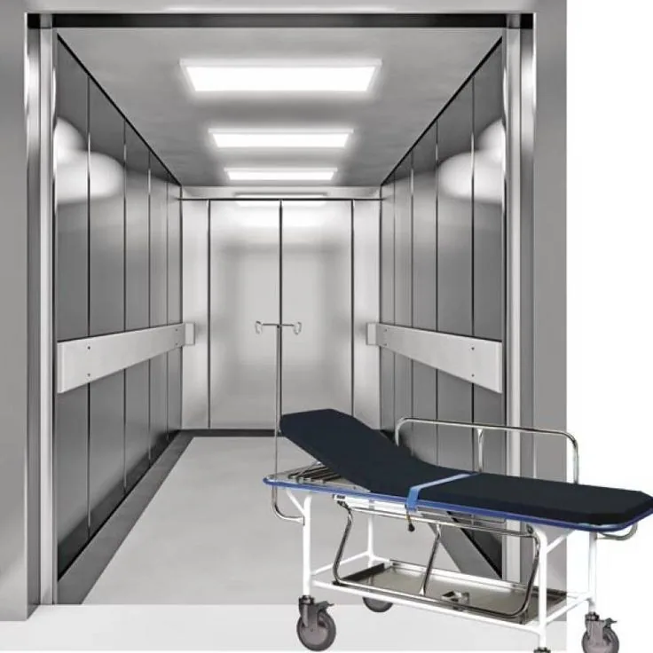 Stainless steel stretcher elevator cabin with LED ceiling panels and side bumper rails