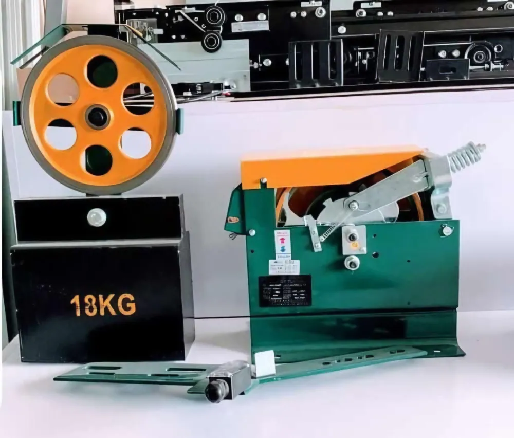 Elevator governor sheave with orange rope wheel, 18 kg cast tension weight and safety-gear trip frame forming a complete overspeed protection set