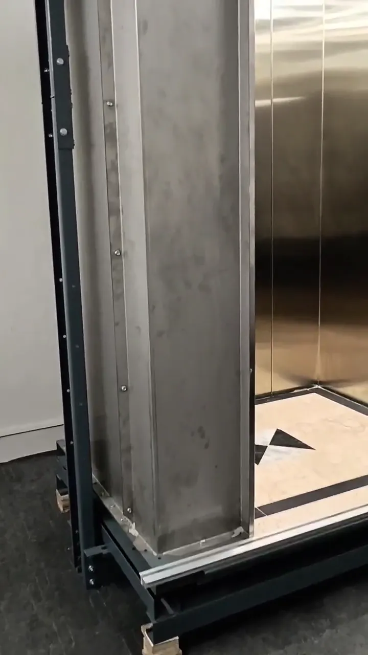 Stainless-steel lift cabin with decorative ceiling