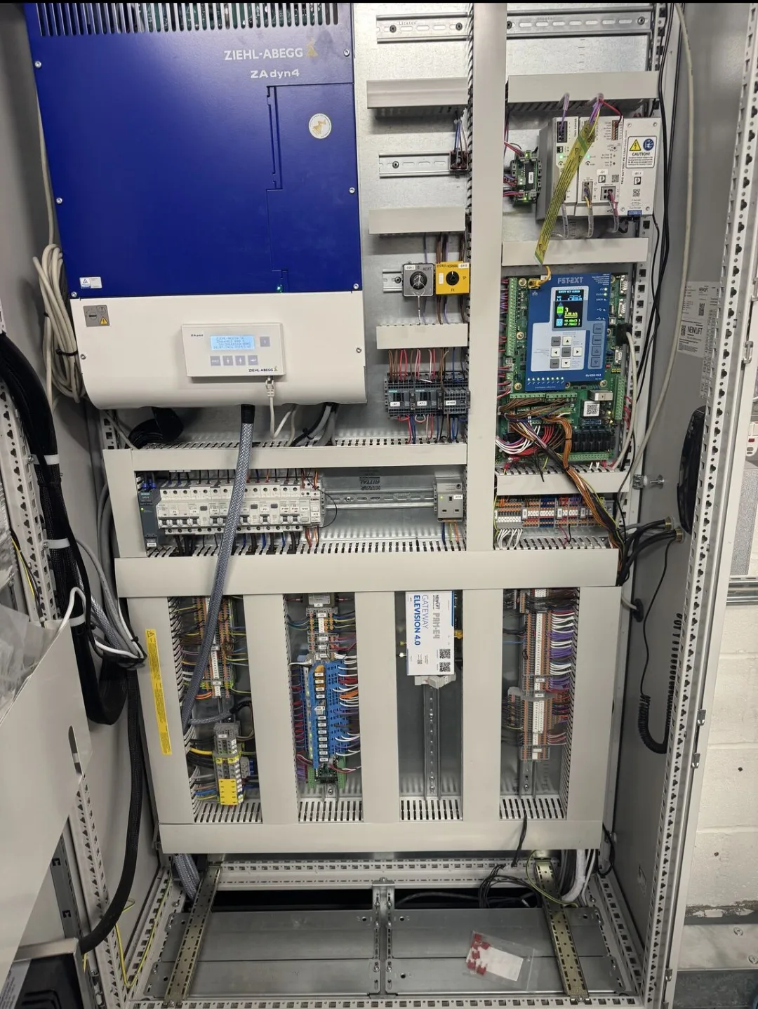 Ziehl-Abegg ZAdyn4 VVVF elevator drive with NewLift FST-2XT controller and Elevision 4.0 IoT gateway in control cabinet