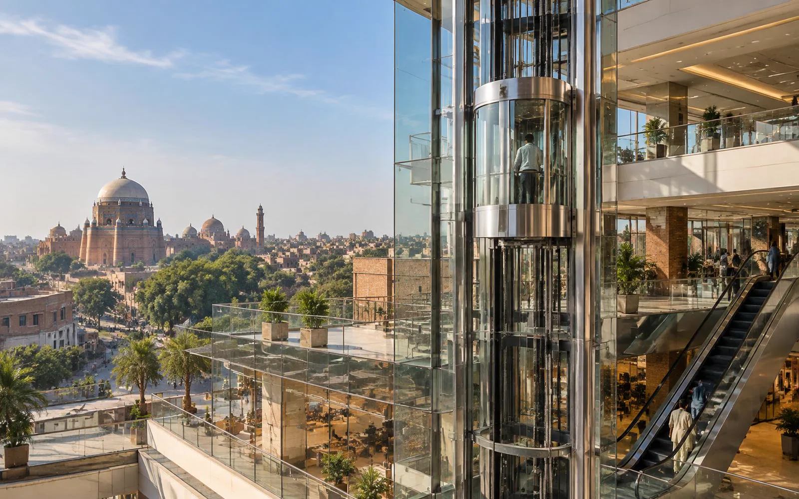 Glass panoramic elevator and escalator overlooking Multan's historic Shah Rukn-e-Alam skyline — Liftech Global